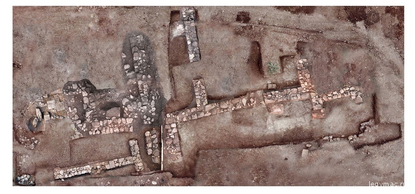 This undated photo provided by the Greek Ministry of Culture on Tuesday, Nov. 13, 2018, shows remains of walls and floors, probably from houses, from the lost ancient city of Tenea. The ministry said Tuesday archaeologists have located the first tangible remains of the city that, according to tradition, was first settled by Trojan war captives after the Greek sack of Troy. (Greek Culture Ministry via AP)