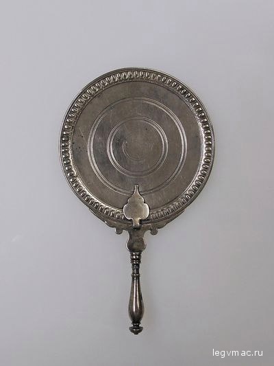 Silver Roman mirror. Early Imperial period 1st century AD. The name of the owner Iris is inscribed  on  the back Courtesy of the Metropolitan Museum of Art.